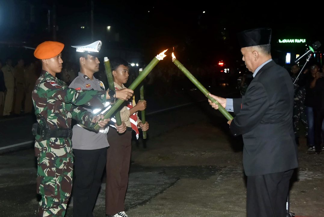 Personel Lanud Raden Sadjad Natuna Berpartisipasi dalam Upacara Taptu dan Pawai Obor Peringatan HUT ke-79 Kemerdekaan RI di Natuna